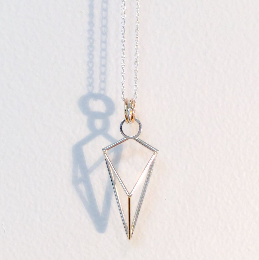 geometric arrow pendant
