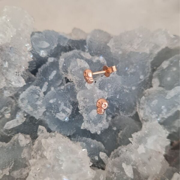 Tiny skull stud earrings rose gold