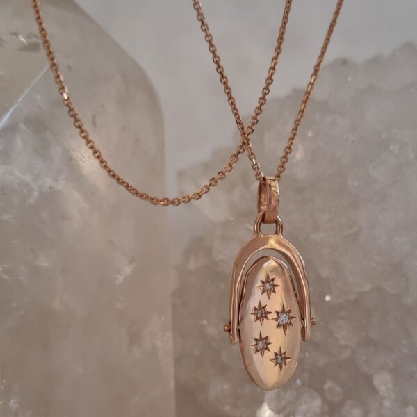 rose gold spinning pendant set with diamonds