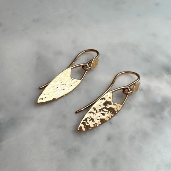 Artefact earrings with hammer tone finish in yellow gold