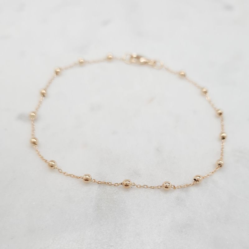 juju gems jewellery beaded chain bracelet in solid 18ct yellow gold, small beads are separated by lengths of trace chain
