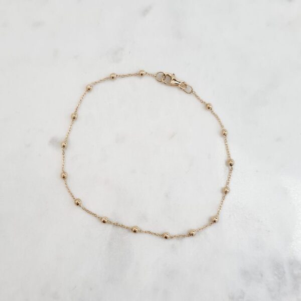 juju gems jewellery beaded chain bracelet in solid 18ct yellow gold, small beads are separated by lengths of trace chain
