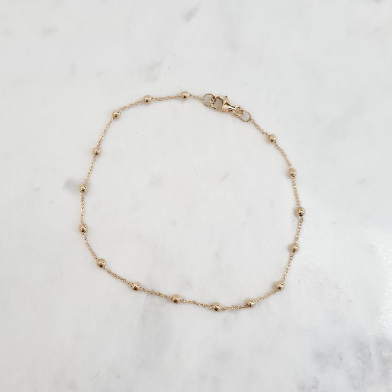 juju gems jewellery beaded chain bracelet in solid 18ct yellow gold, small beads are separated by lengths of trace chain