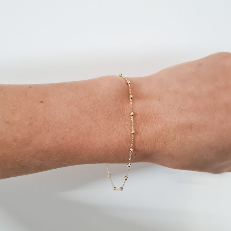 juju gems jewellery beaded chain bracelet in solid 18ct yellow gold, small beads are separated by lengths of trace chain
