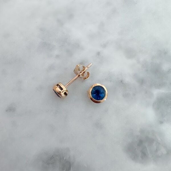 round sapphire bezel set stud earrings