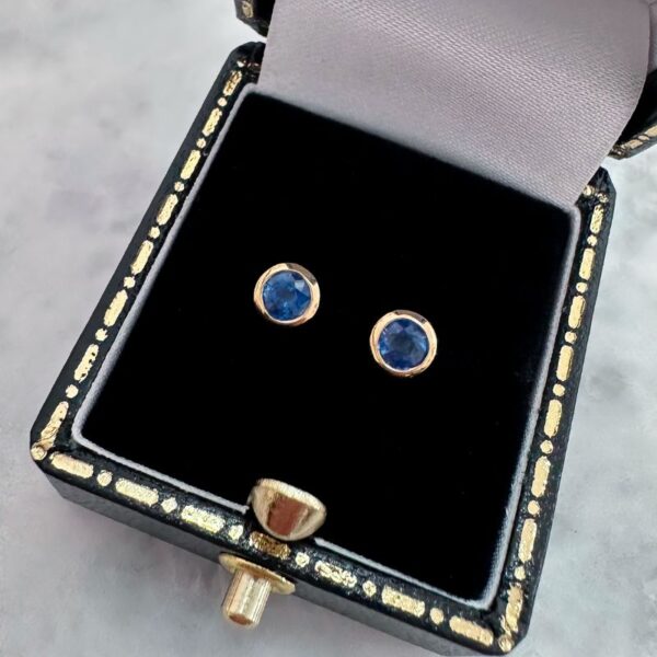 round sapphire bezel set stud earrings