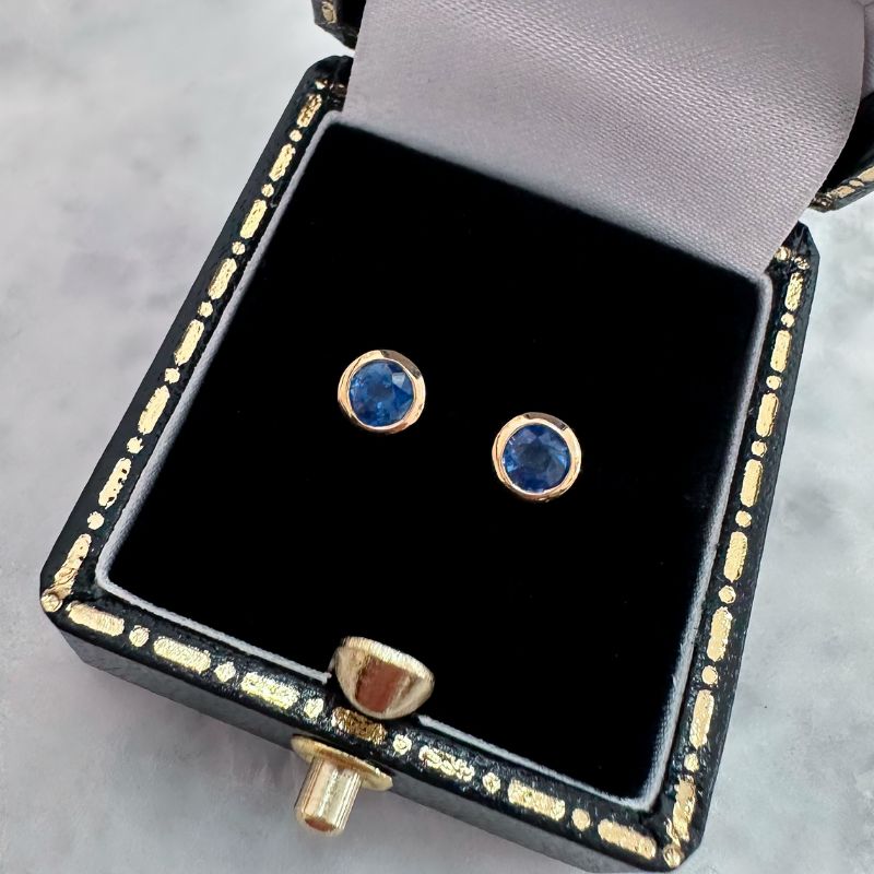 round sapphire bezel set stud earrings