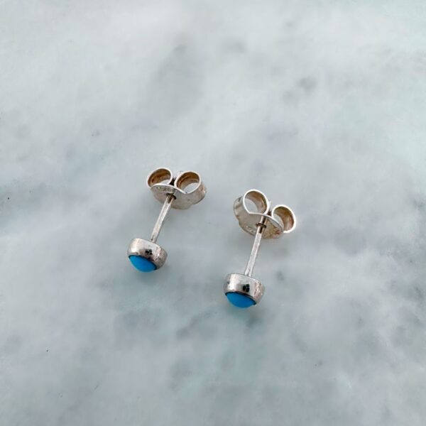 Round cabochon sleeping beauty turquoise stud earrings with silver fittings