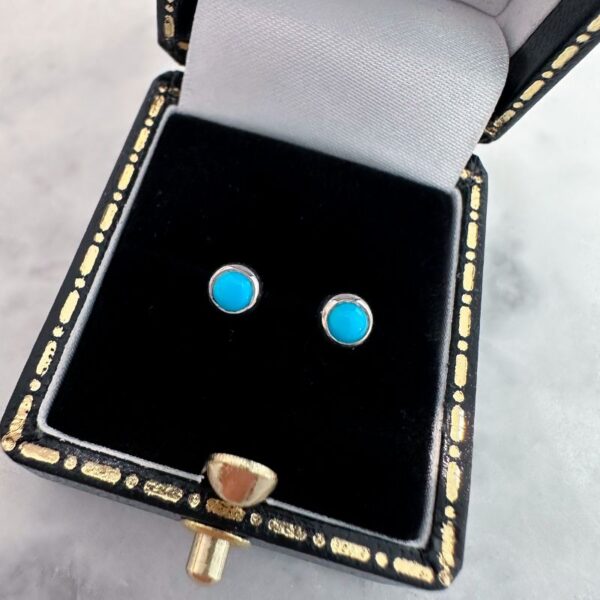 Round cabochon sleeping beauty turquoise stud earrings with silver fittings