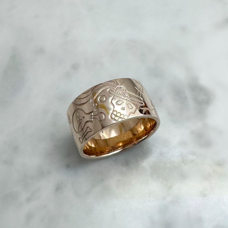 Wide yellow gold flat band with voodoo markings