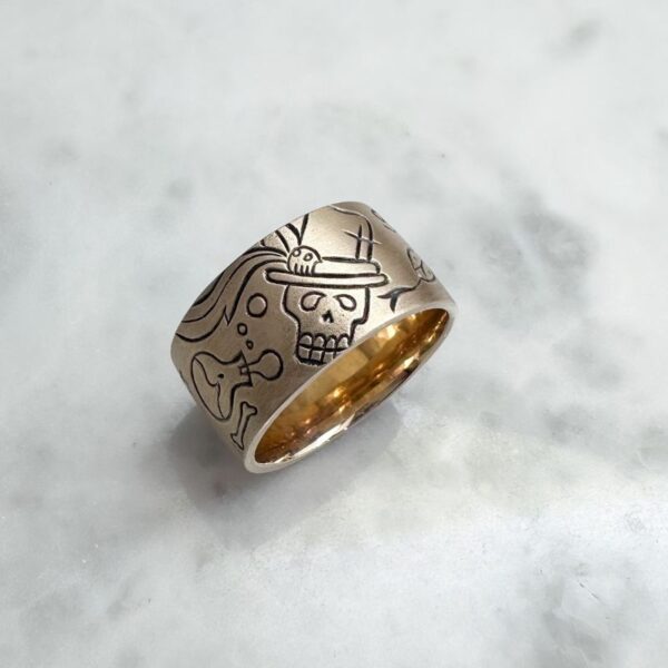 Yellow gold wide flat band with voodoo markings, satin finish and patina