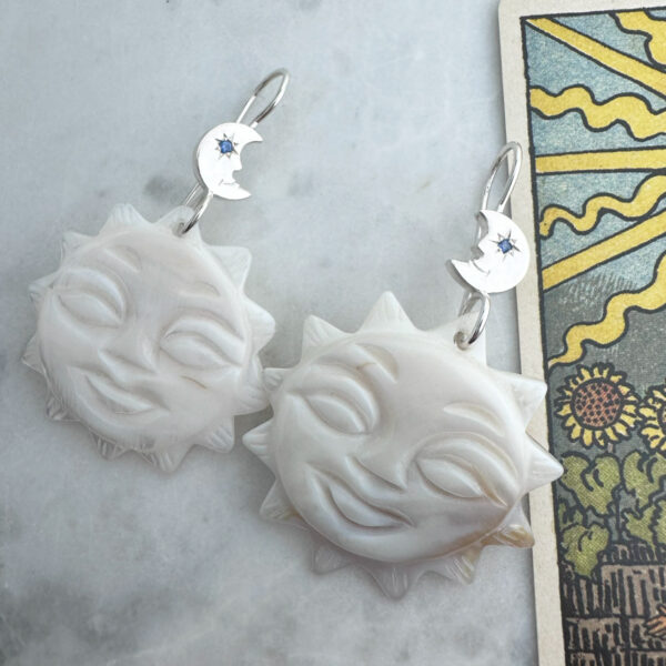 juju gems jewellery Sol earrings made from mother of pearl with crescent moon hooks with sapphire eyes
