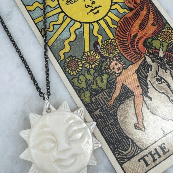 juju gems jewellery sol pendant made from mother of pearl with long blackened chain
