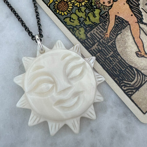 juju gems jewellery sol pendant made from mother of pearl with long blackened chain